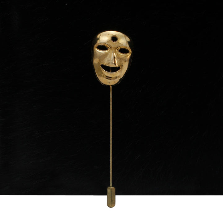 Gold mask lapel pin by Ani Accessories featuring a unique mask design for stylish accessories