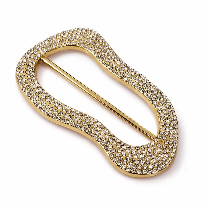 ANI Accessories angled view of gold rhinestone pavé freeform slide buckle with centre bar