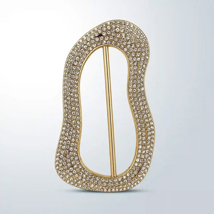 ANI Accessories gold freeform slide buckle covered in clear pavé rhinestones, front view on grey background 