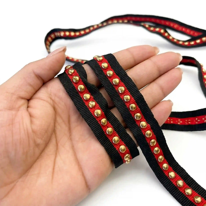 ANI Accessories gold studded ribbon with red stripe laid flat on white background 