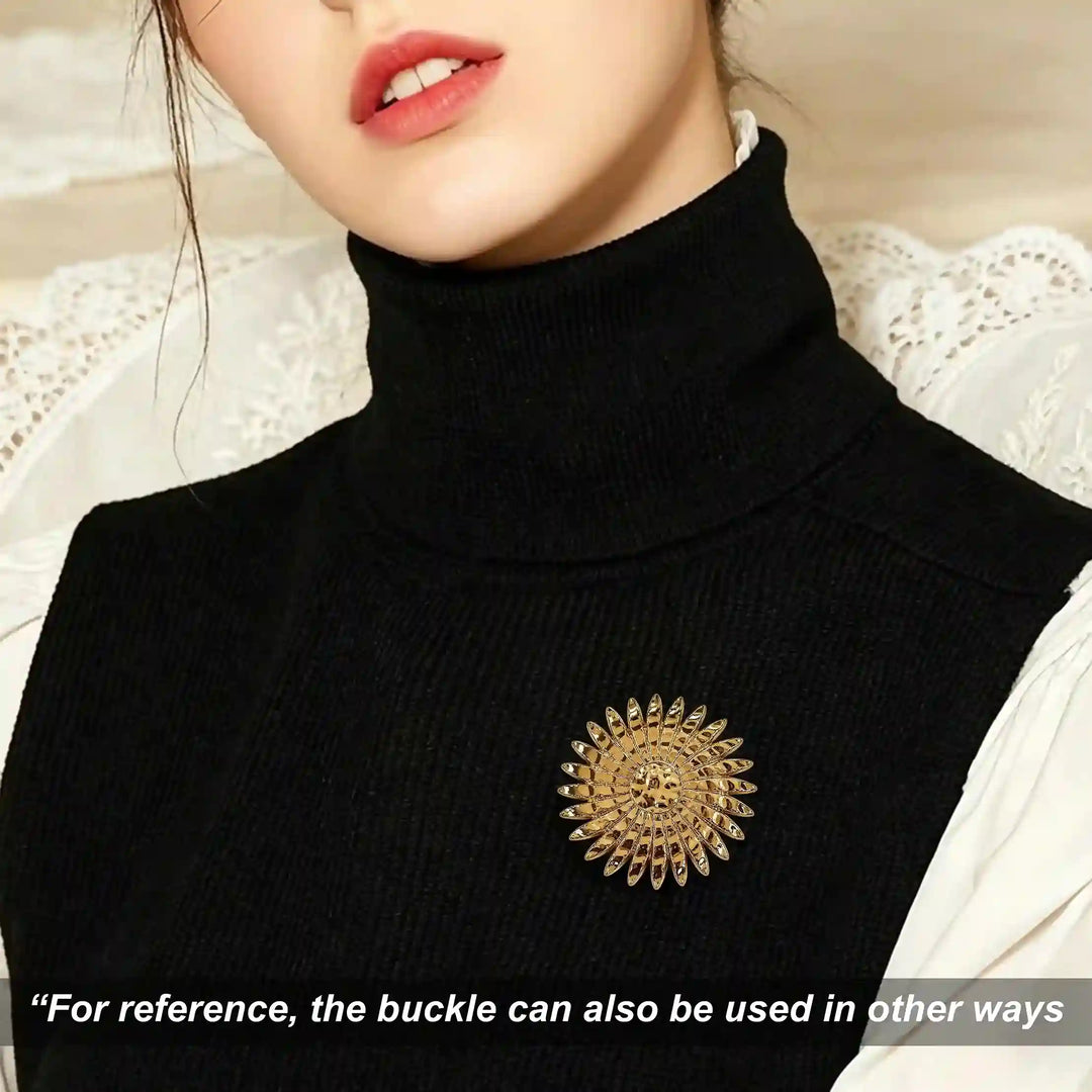 ANI Accessories gold sun brooch pinned on a woman's black turtleneck sweater 