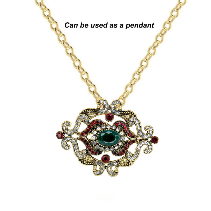 ANI Accessories green stone baroque brooch worn as a pendant on a gold chain 