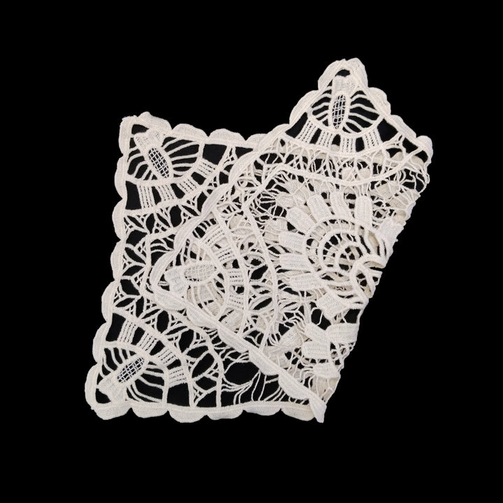 ANI Accessories large cream crochet patch laid at an angle on a black background 