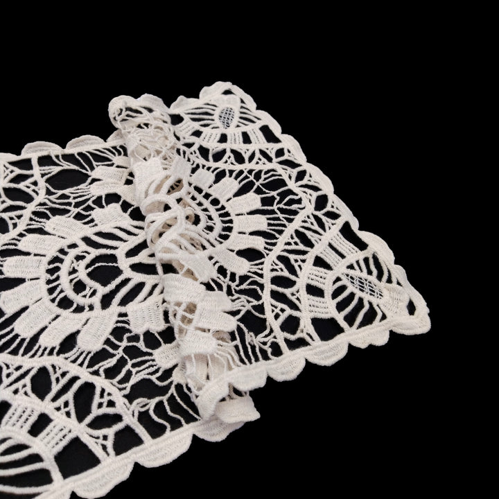 ANI Accessories folded corner of large cream cotton patch showing the scalloped edge 