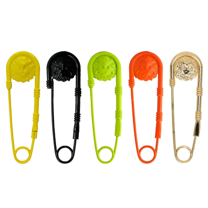 Lion head safety pin brooches in yellow, black, neon, orange and gold white color background 