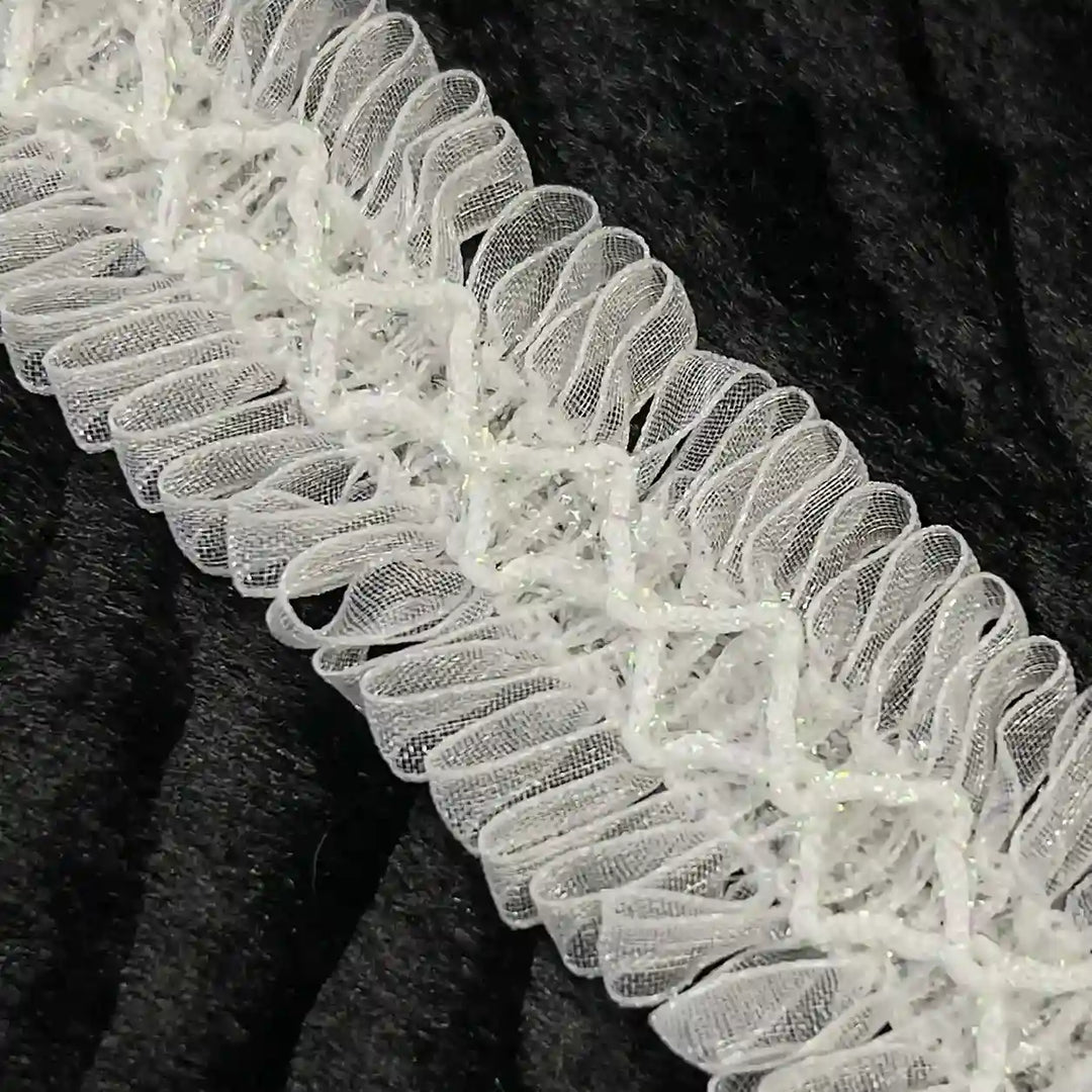 ANI Accessories close-up of loop fringe trim with diamond cord centre with black color background 