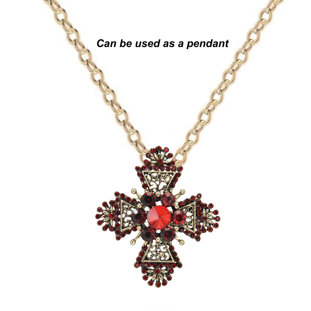 ANI Accessories maltese cross brooch worn as a pendant on a gold chain 