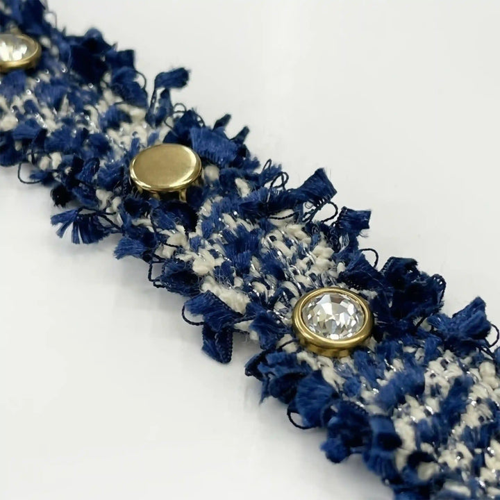 ANI Accessories close-up of rhinestone studs on navy tweed braid trim 