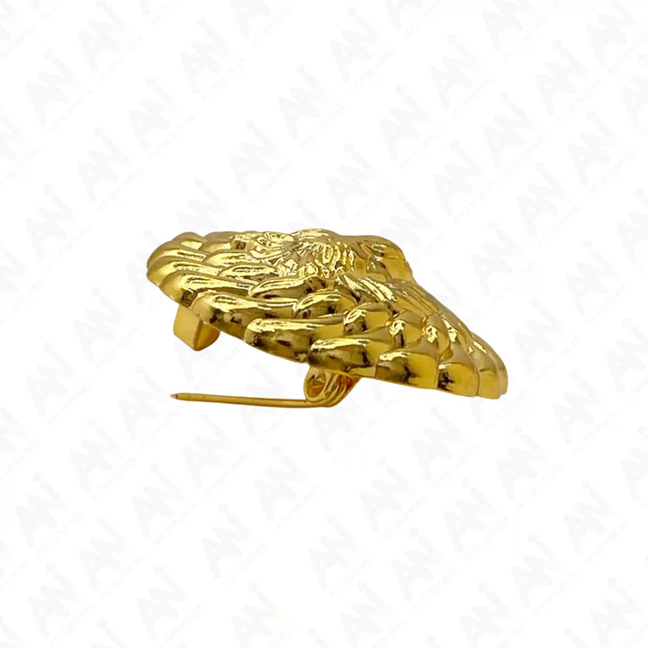Side view of the gold lion lapel pin showing the raised rope border and pin