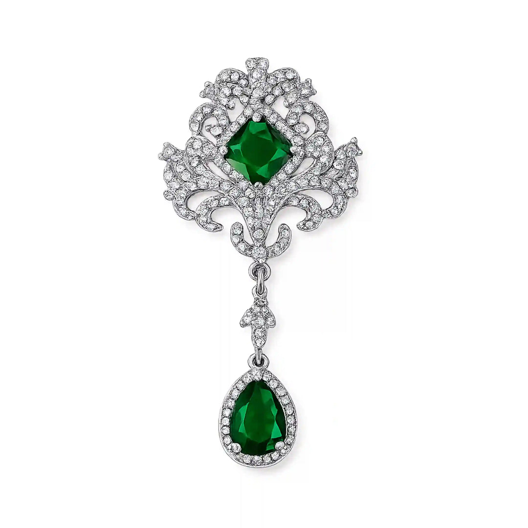 ANI Accessories ornate emerald dangle brooch in silver with clear rhinestones and teardrop drop, on white color background 