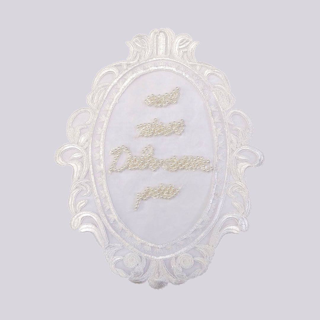 ANI Accessories pearl patch for dress with ornate scroll leaf frame, on light grey 