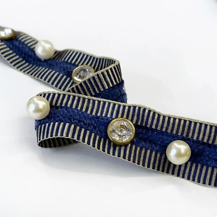 ANI Accessories pearl and stone lace in navy, folded to show the gold metal settings with white color Background 