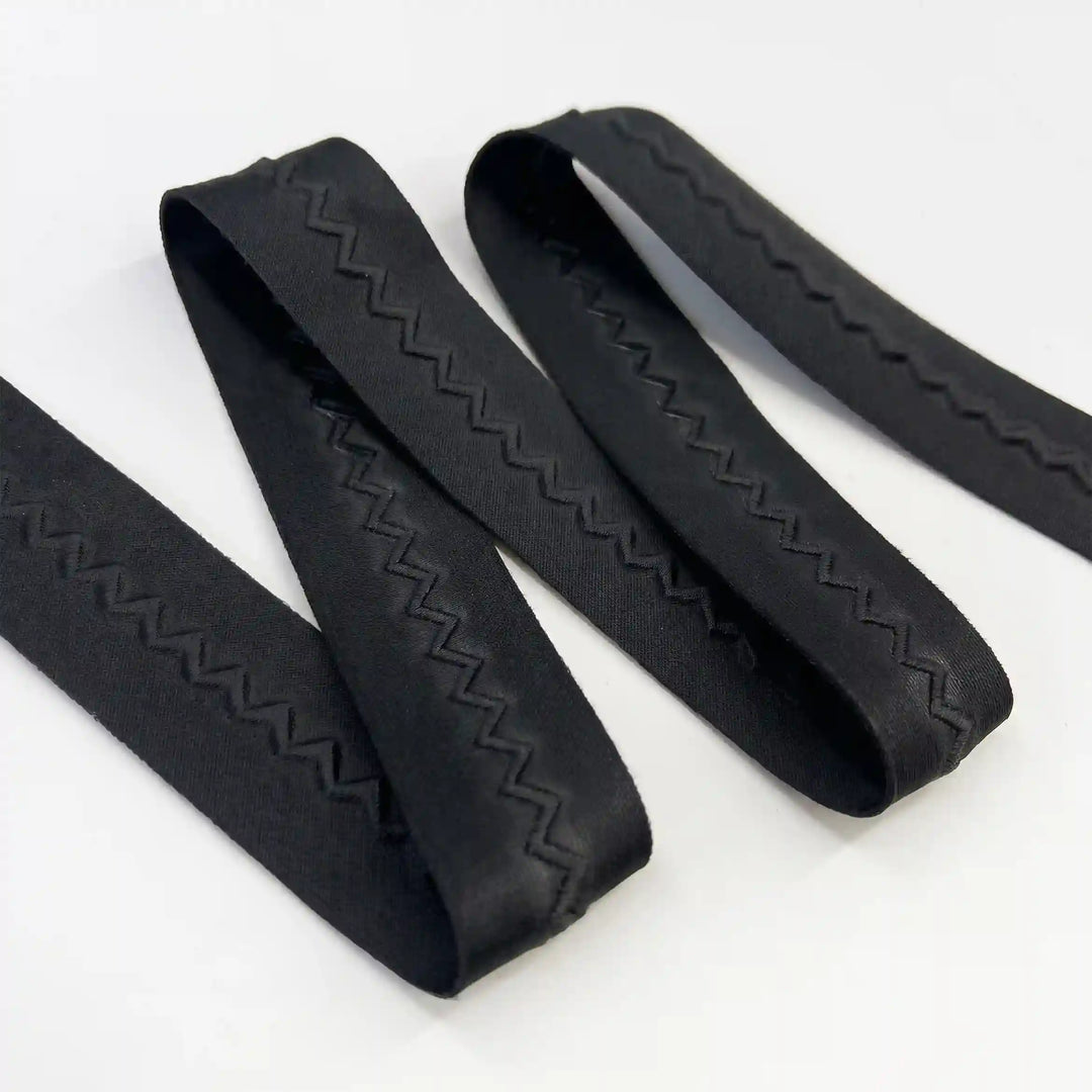 ANI Accessories plain black lace border with a tone-on-tone zig zag, folded with white color background 