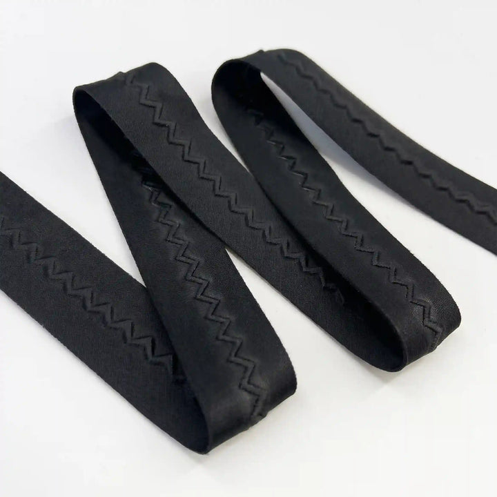 ANI Accessories plain black lace border with a tone-on-tone zig zag, folded with white color background 