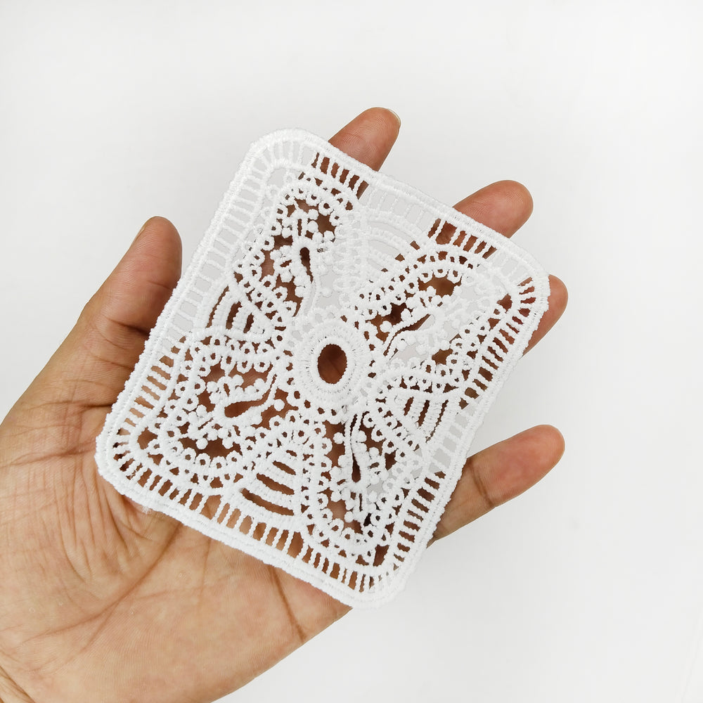 ANI Accessories rectangle lace patch held in an open palm to show its size