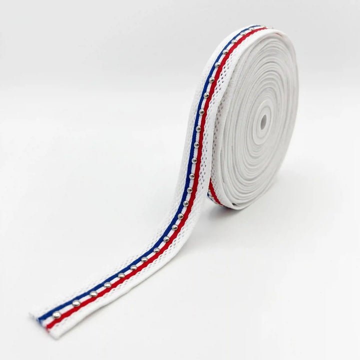 ANI Accessories close-up of red, white and blue ribbon trim with silver metal studs with white color background 