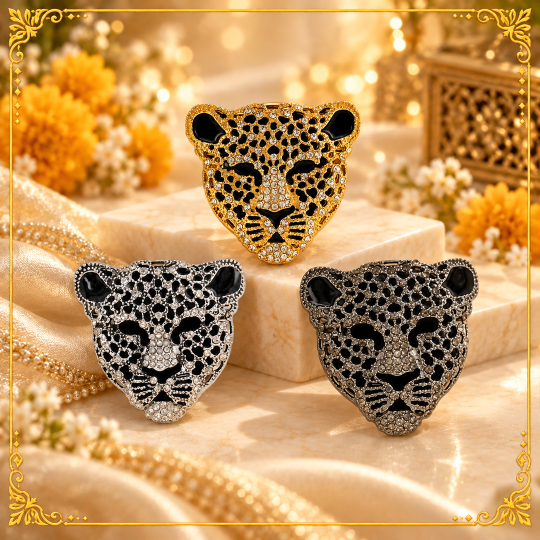 ANI Accessories rhinestone leopard brooch for men in gold, silver and gunmetal on cream satin with marigold flowers 