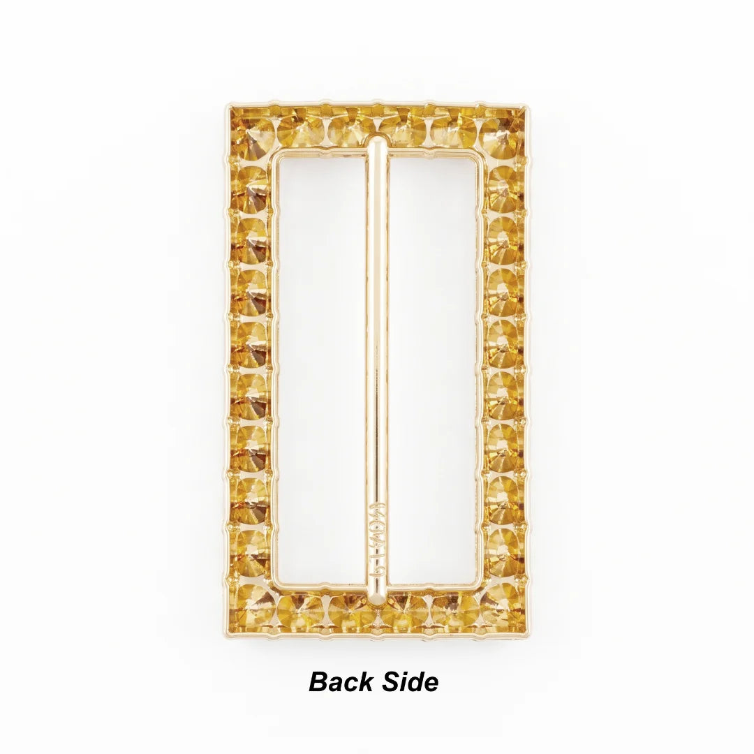 ANI Accessories rectangular rhinestone gold belt buckle back side, showing open-back stone settings and central bar.
