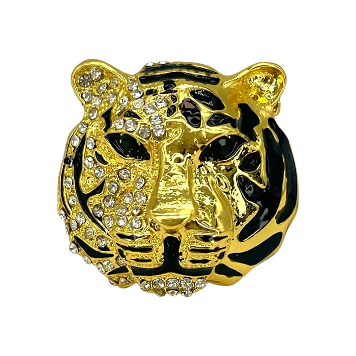 Shiny gold rhinestone tiger brooch with black enamel stripes and black eyes with white color background 