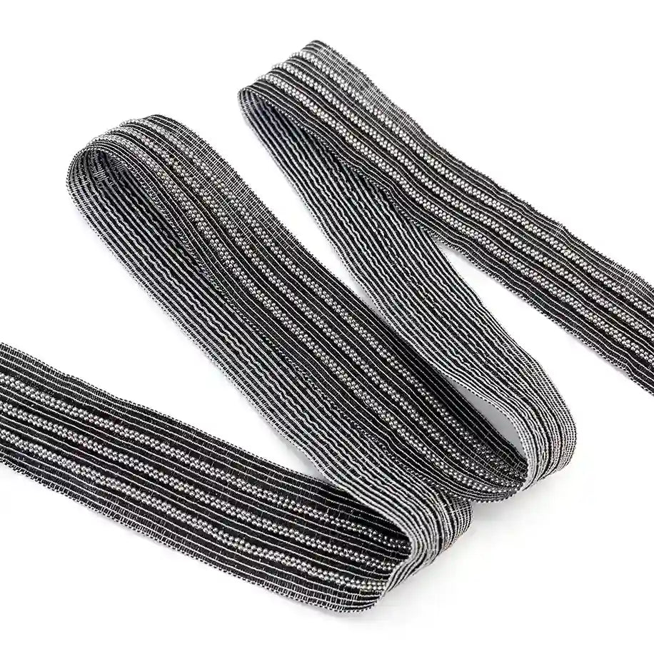 ANI Accessories silver beaded lace trim with three bead rows, folded in a zigzag with white color background 
