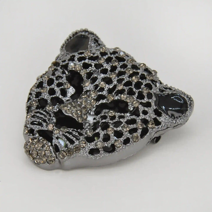 ANI Accessories silver leopard head brooch from a side angle showing the raised rhinestone face 