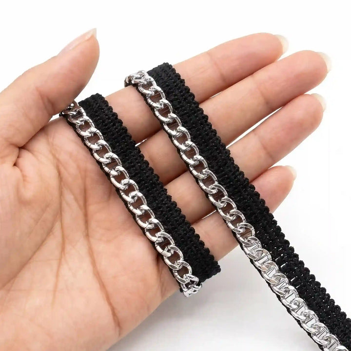 ANI Accessories silver piping lace on black tape held in hand with white color background 
