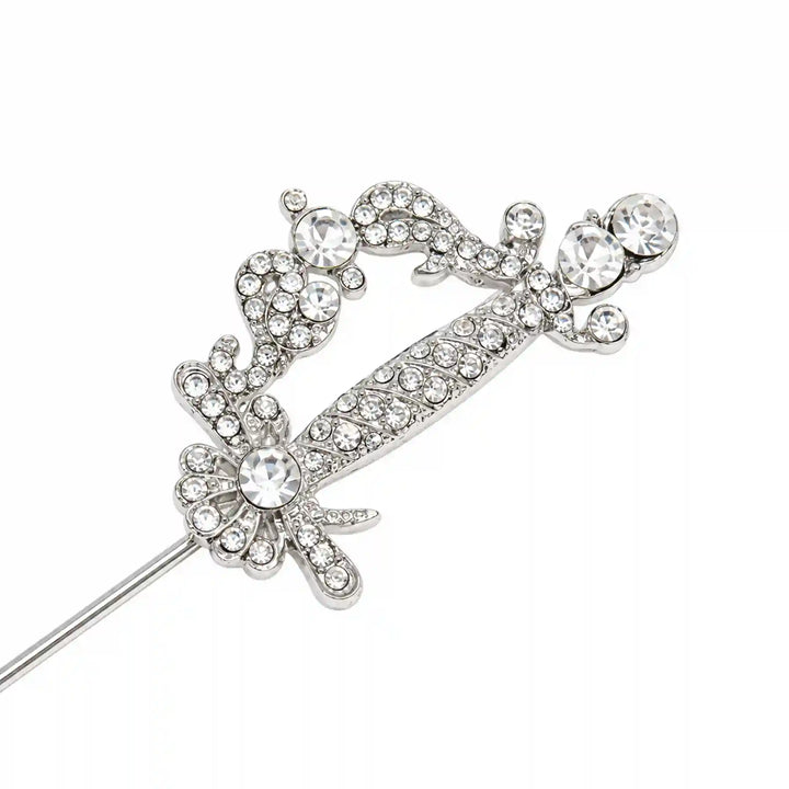 ANI Accessories silver sword lapel pin with rhinestone floral hilt, close-up with white color background 