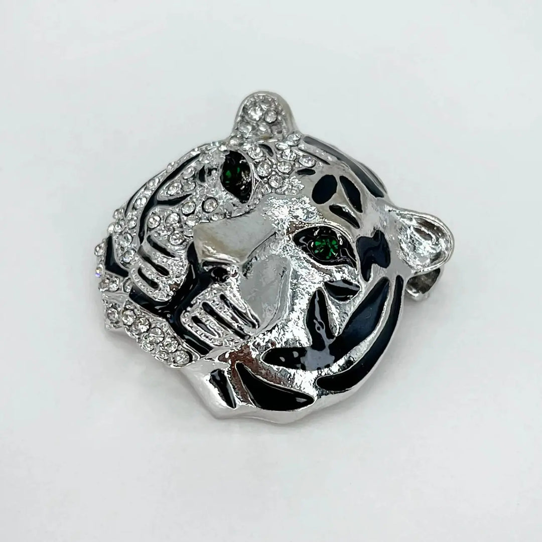 Back side of the silver tiger brooch showing the brooch pin with white color background 