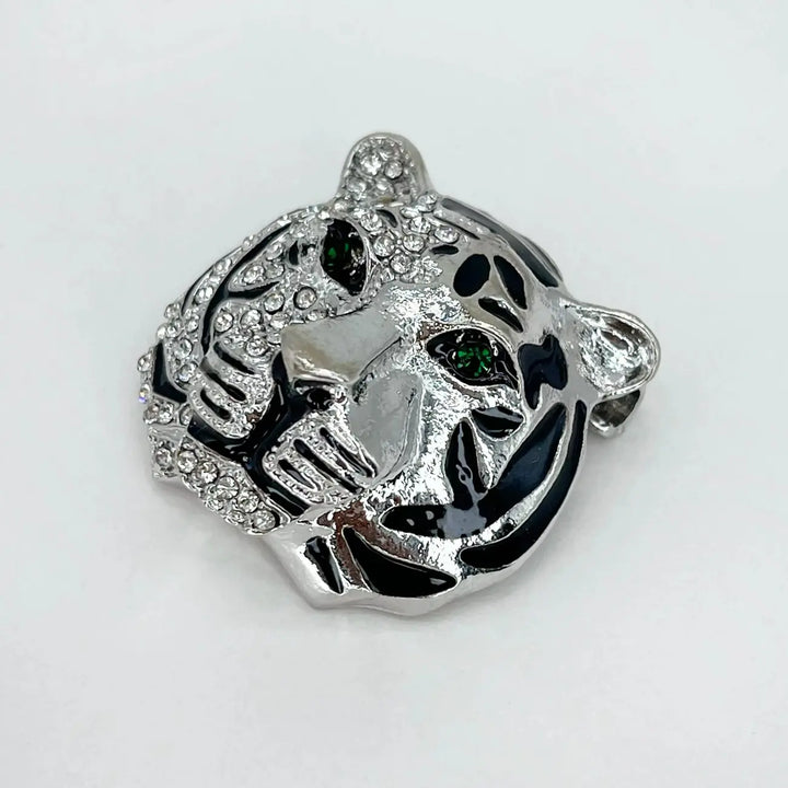Back side of the silver tiger brooch showing the brooch pin with white color background 