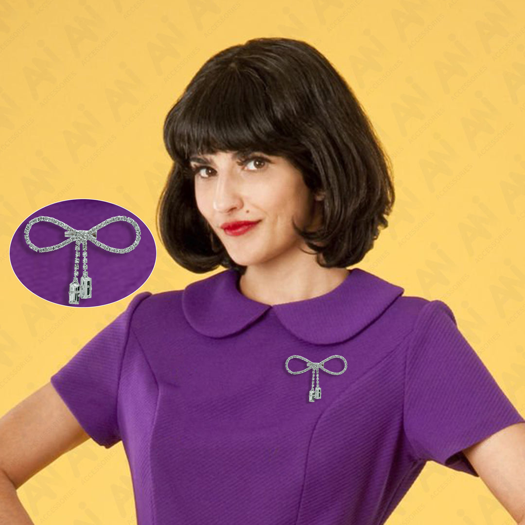 Elegant Sparkling Bow Brooch with Hanging Sapphire Two Stone showcased on a stylish model in purple attire