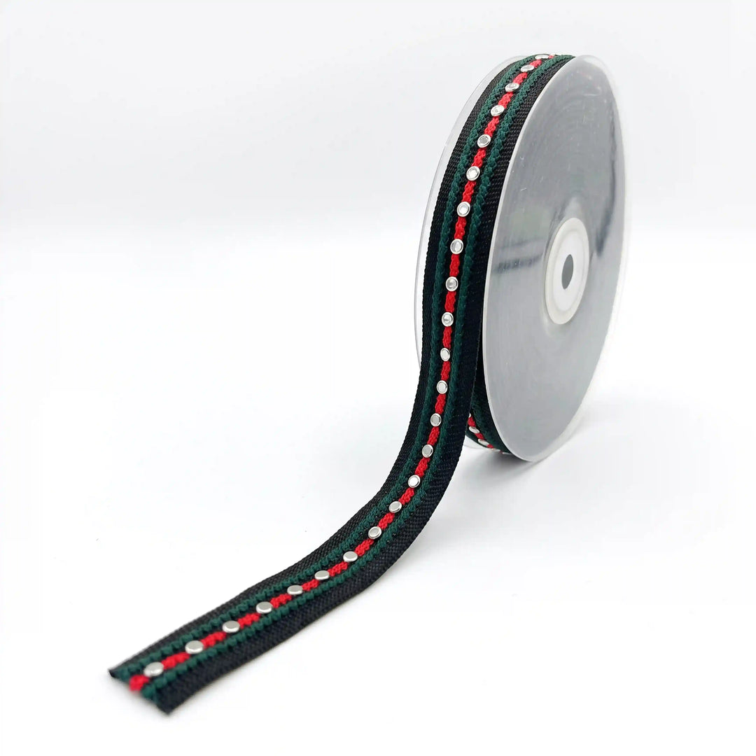 ANI Accessories striped webbing tape on a roll, black with green and red stripes with white color background 