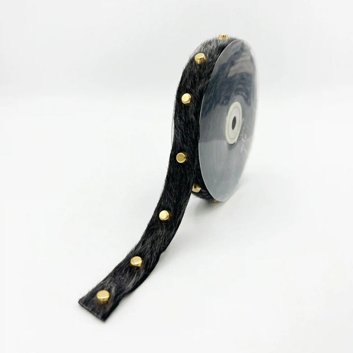 ANI Accessories studded black trim with fur on a roll with white color background 