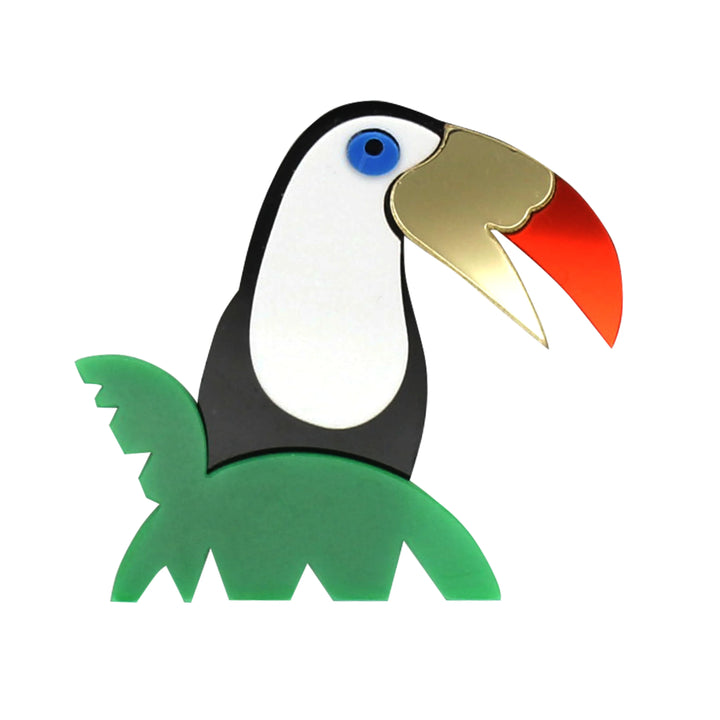 Stylized toucan brooch in layered acrylic with mirror gold and red beak with white color background 
