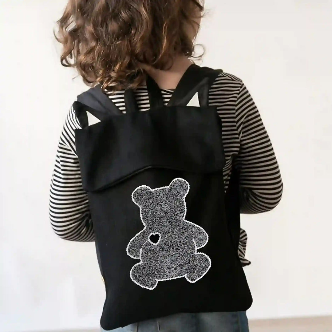 ANI Accessories animal patch for backpacks: white teddy bear stitched on a black backpack 