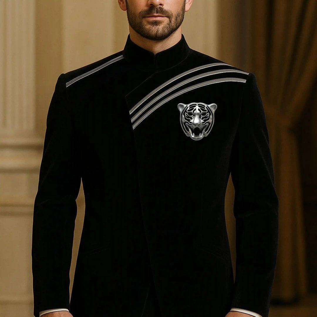 Man wearing a silver tiger head emblem on the chest of a black bandhgala
