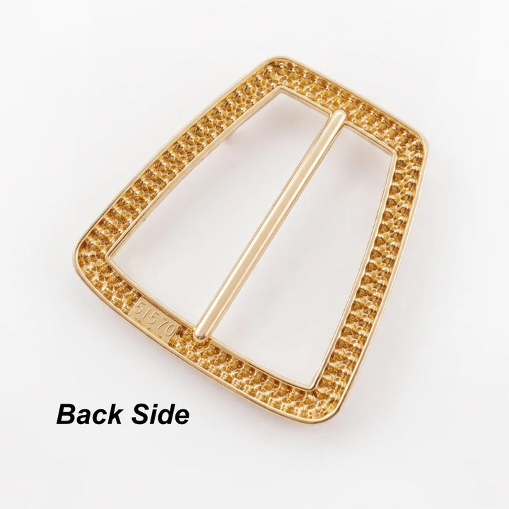 ANI Accessories trapezoid rhinestone gold belt buckle back side, showing textured gold metal frame and polished central bar