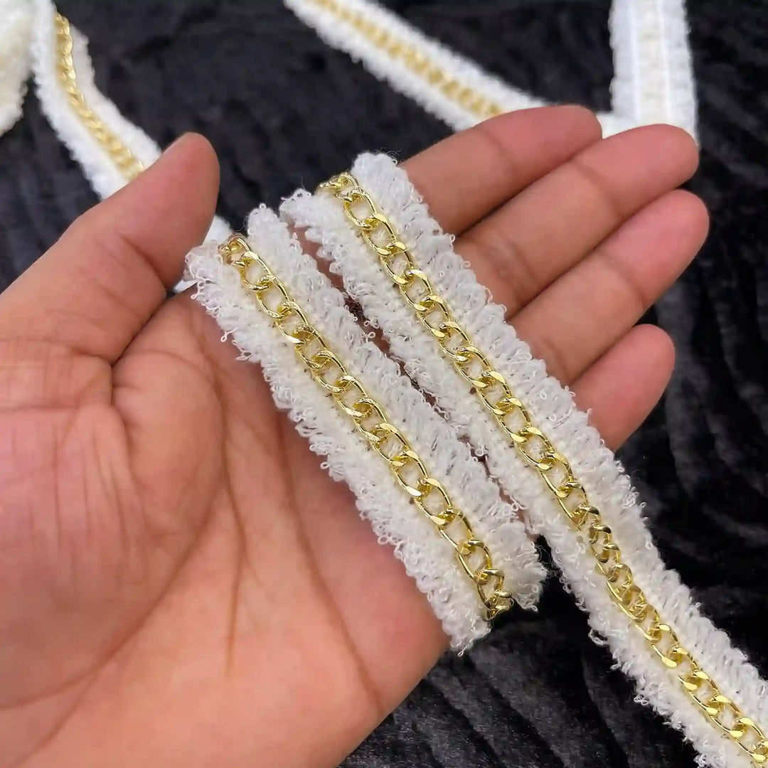 ANI Accessories tweed chain trim held in hand 