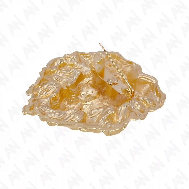 Gold lion brooch with intricate detailing and a secure pin closure for stylish adornment
