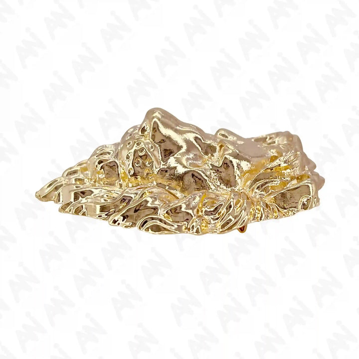 Gold lion brooch from Ani Accessories featuring intricate design and luxurious shine