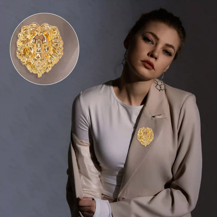 Elegant gold lion brooch worn on a model's blazer, showcasing intricate detailing and bold design