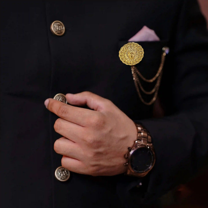 Elegant lion head gold brooch worn on a suit lapel, adding sophistication to formal attire
