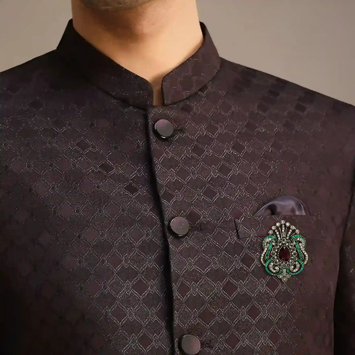 ANI Accessories Victorian rhinestone brooch pinned on the chest of a dark bandhgala jodhpuri suit 