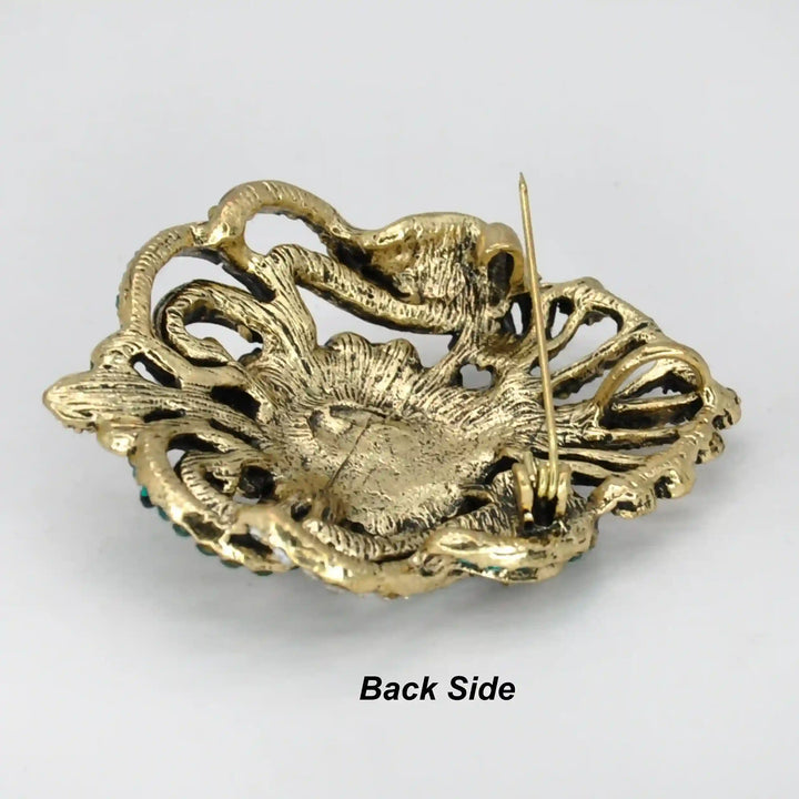 ANI Accessories Victorian rhinestone brooch back side showing the antique gold base and pin 