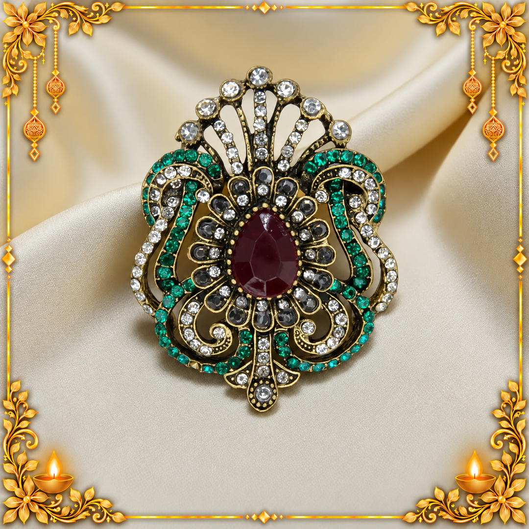 ANI Accessories Victorian style rhinestone brooch with red centre stone and green rhinestones on gold satin 