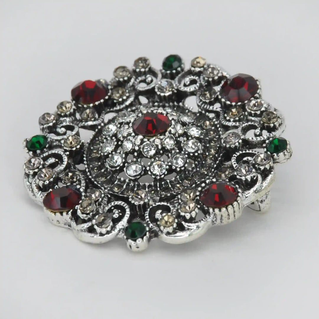 ANI Accessories vintage crystal brooch from an angle showing the raised crystal dome 