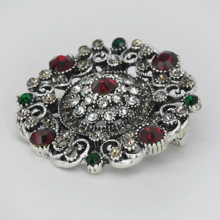 ANI Accessories vintage crystal brooch from an angle showing the raised crystal dome 