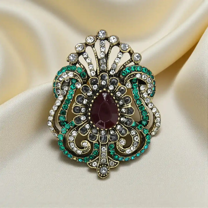 ANI Accessories vintage brooch for women with deep red stone, smoky grey petals and green rhinestones on satin with 