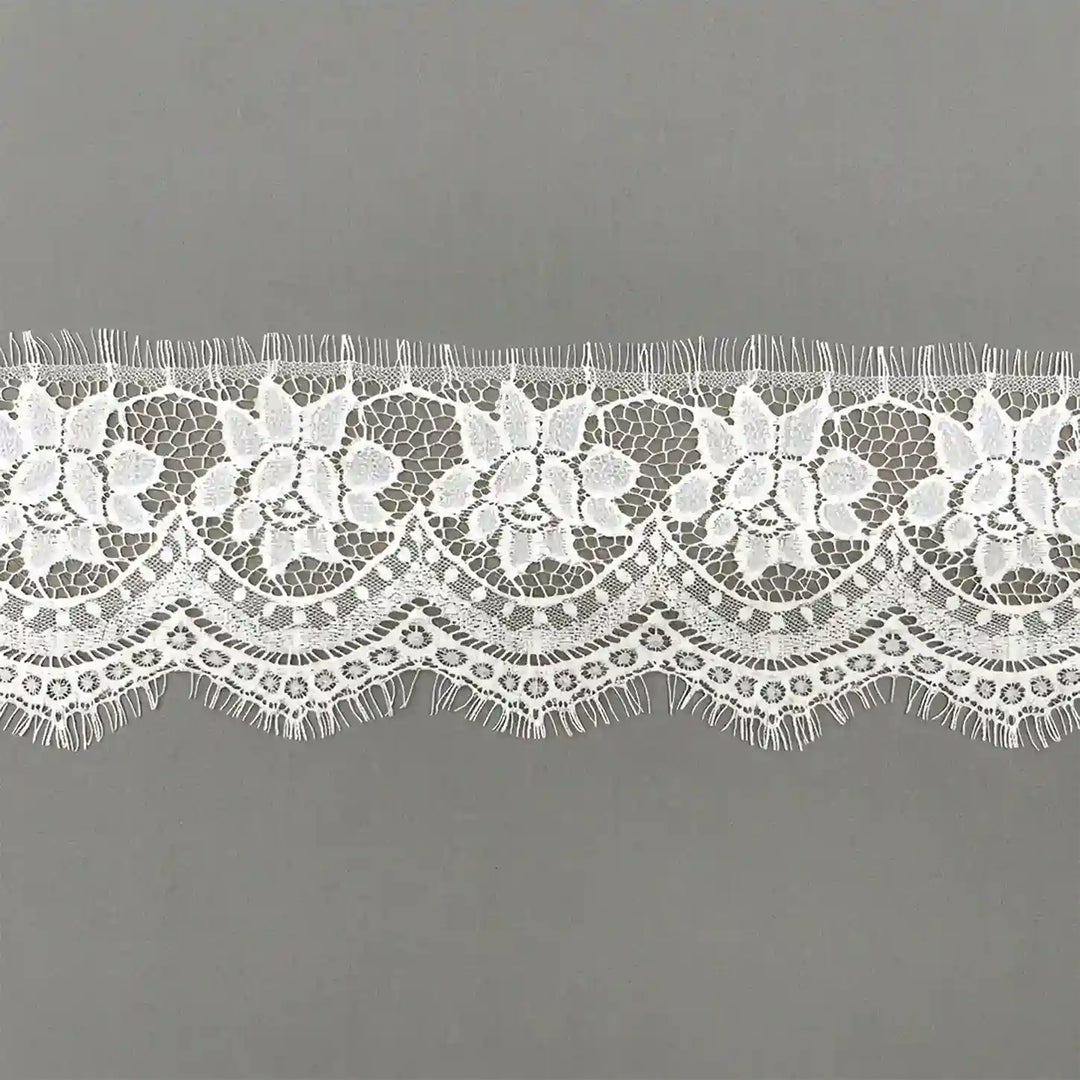 ANI Accessories white 5 inch Chantilly lace trim with a scalloped edge with gray color background 