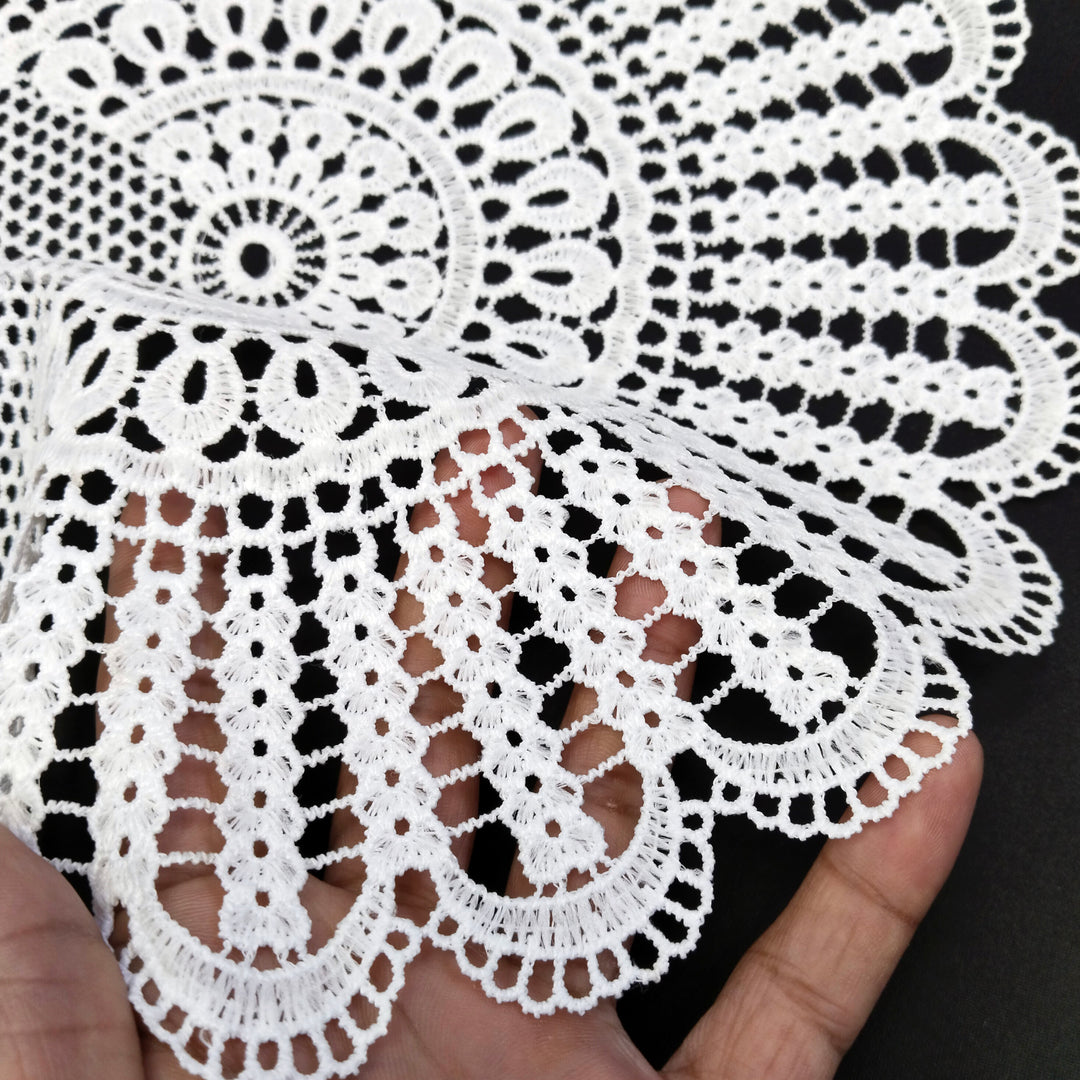 ANI Accessories white cotton patch held in hand to show the open crochet-style work 