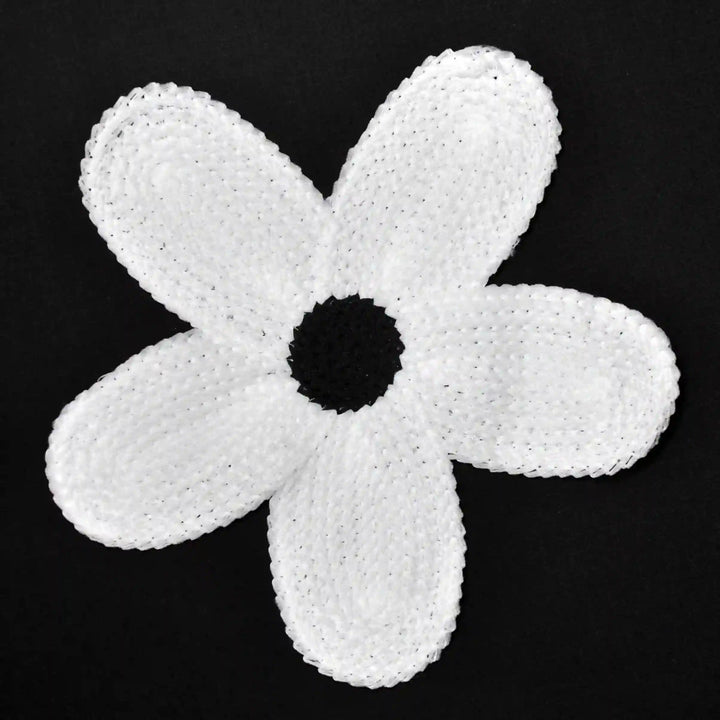 ANI Accessories white daisy guipure lace patch in spun poly with five petals, on black background 
